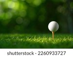 Close up golf ball on tee with...