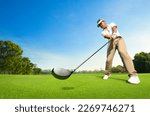 Small photo of Motion action of golfer teeing off with drivers.