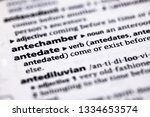 Small photo of Blurred close up to the partial dictionary definition of Antedate