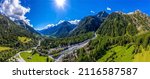 Panorama of a mountain valley. Blu sky with bright sun over mountain valley panoramic landscape