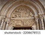 Small photo of Semur-en-Brionnais - France - August 7th 2022 - Carvings in stone on the exterior or restored building in one of the plus Beaux village de France