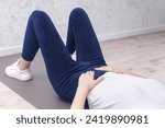 woman doing various sports moves - exercises for healthy life, pelvic floor exercise. Home sport workout. Elbows static balance stand. Floor stretching. Healthy lifestyle.