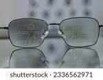Closeup of glasses in optical store, eyeglass progressive lens 