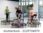 Small photo of Trampoline for fitness girls are engaged in professional sports, the concept of a healthy lifestyle jumping trampoline woman fitness sport training, from workout active in lifestyle from body trainer