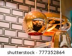 Small photo of Modern streamlined mirror oval copper chandelier. Bubble metal copper shade pendant.