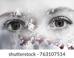 Beautiful double exposure graphic design photography of a pair of deep eyes looking straight with a soft background of a tree branches with hot pink fuchsia red flowers and a blue sky background
