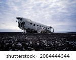 The abandoned DC-3 Airplane on Solheimasandur beach. Airplane wreckage on black sand beach. Douglas Dakota DC3, US navy, South Iceland. 2021