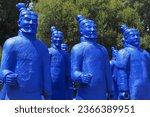 Small photo of Quinta dos Loridos, Portugal - 07 22 2023: Collection of terracotta sculptures in the Bacalhoa Buddha Eden park. Blue painted copies of Terracotta Army depicting the armies of Emperor Qin Shi Huang.