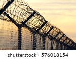 Barbed Wire Steel Wall Against...