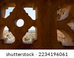 Small photo of View of Jaisalmer city through sandstone made beautiful jharokha, stone window. Interior of Rani Mahal or Rani Ka Mahal, inside Jaisalmer fort. Rajasthan, India. UNESCO World heritage site.