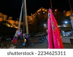 Small photo of Jaisalmer,Rajasthan,India - October14,2019 : Womens' saree and bag are being sold at market place beside Jaisalmer Fort or Golden Fort. A living fort -made of yellow sandstone. UNESCO heritage site.