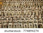 Small photo of front view of Jizo statues, giving comfort to the women who have miscarried, lined up in hasedera temple Kamakura japan