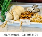 Small photo of Petaluma, California, USA - May 25th, 2023: Expensive mushrooms on sale at a local market.