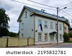 Small photo of Traditional Estonian house of two floors with triangular roof and old fashioned wooden fence. Tartu, Estonia. European historic architectural details.