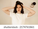 Small photo of Sad woman with migraine strong headache disease. Depression. Overstressed woman with head pain touches head