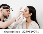 Small photo of Rhinoplasty is surgical procedure that involves altering shape of nose to improve appearance and enhance breathing. ENT consultation before rhinoplasty plastic surgery