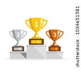 winners podium with cups.... | Shutterstock .eps vector #1034651581