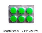 Small photo of Mint tablets lozenges for coughing and perspiration in the throat in a blister pack on a white background. Pills package. Pharmaceutical blister pack. Pack of pills with tablets.