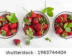 Strawberries With Leaves In...
