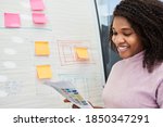 African student or business woman on flipchart with sticky notes and graph