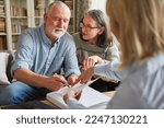 Small photo of Seniors sign a contract or power of attorney at home after a consultation