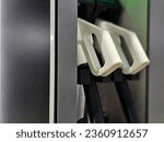 Small photo of Types of EV chargers in EV Charger station in focus. AC EV charger. Fast charger of EV in station. Alternative energy. electric car charger station.High quality photo