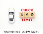 Small photo of Flatlay picture diorama car with check DSR limit. DSR is Debt Service Ratio.
