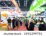 Abstract blur people in exhibition hall event trade show expo background. Business convention show, job fair, or stock market.