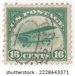 Small photo of USA - 1918: An 16 cents green Air Post stamp depicting Airplane biplane Curtiss Jenny in flight. For prepayment of postage on all mailable matter sent by airmail