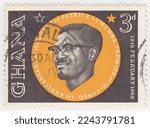 Small photo of GHANA (GOLD COAST) - 1962 June 30: An 3 pence black and orange postage stamp depicting portrait of Patrice Lumumba. 1st anniversary of the death of Patrice Lumumba, premier of Congo