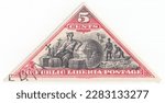 Small photo of LIBERIA - 1894: An 5 cents carmine and black postage stamp depicting a sitting “Commerce,” Globe, cargo and crewmen. Republic of Liberia, is a country on the West African coast