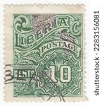 Small photo of LIBERIA - 1918: An 10 cents dark green postage stamp depicting Numeral with geometry and floral ornaments. Republic of Liberia, is a country on the West African coast