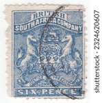 Small photo of RHODESIA - 1890: An 6 pence ultramarine postage stamp depicting Arms of the British South Africa Company. BSAC or BSACo was founded in 1889 with the support of the British Government