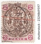 Small photo of RHODESIA - 1897: An 2 pence brown and lilac-rose postage stamp depicting Arms of the British South Africa Company. The ends of ribbons containing motto cross the animals legs