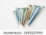 Small photo of Large group of different scows and bolts on the white background