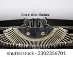 Small photo of A close up of an old fashioned typewriter that has printed out the words Dear Sir Madam
