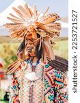 Small photo of Malibu, California, USA - April 9, 2022. Powwow. Portrait of a Native American man in Full Regalia. Chumash Day Powwow and Intertribal Gathering.