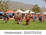 Small photo of Malibu, California, USA - April 9, 2022. Powwow. Men's competitive dancing. Native Americans dressed in full regalia. Details of regalia close up. Chumash Day Powwow and Intertribal Gathering.