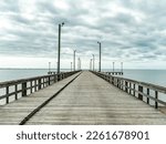 A wide empty pier with street lights in Texas