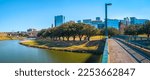 Small photo of Fort Worth panoramic city skyline, buildings, and walking trails over the Trinity River Bridge, a cityscape with natural open space in Texas