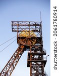 Small photo of The elevator of the hoist shaft in the black coal mine. Coal mine hoist against the sky