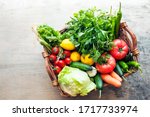 Vegetables in the basket organic vegetables on wooden background