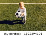 Cute Little Boy Playing Soccer...
