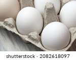 Small photo of White chicken egg in a package close-up. Source of calcium, protein, lecithin, choline, vitamin, potassium, magnesium, zinc, selenium, copper, iodine, chromium, fluorine