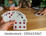 Woman playing with cards with...