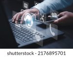 Small photo of Businessman holding smartphone and using computer laptop to calling to operator and inform trouble shooting of computer concept.