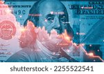 Small photo of Benjamin Franklin face on USD dollar banknote with red decreasing stock market graph chart for symbol of economic recession crisis concept.
