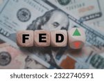 Small photo of FED wording with up and down arrow on USD dollar banknote for Federal reserve increase and decrease interest rate control which effect to America and world economic growth concept.