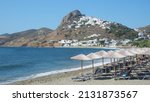Small photo of Magazia famous beach in Skiros island below main picturesque village and castle built uphill, Sporades islands, Greece