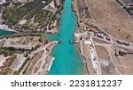 Aerial drone photo of narrow Corinth canal of Isthmus from West submersible bridge and narrow opening of Corinthian gulf to Saronic gulf, Loutraki, Greece